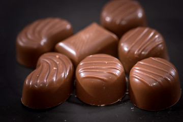 chocolate candies isolated on black