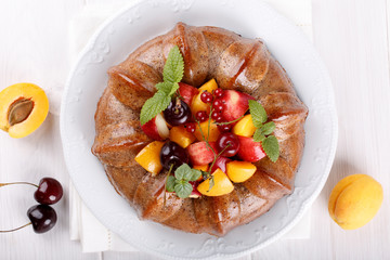 Naked cake derorated fresh fruit and berries