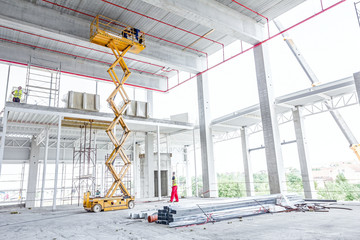 Scissor lift platform on a construction site