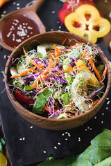 Fototapeta na wymiar Organic vegetarian salad with vegetables and sauce