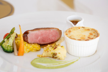 Delicious with beef, pork, cheese, potatoes, vegetables and grav