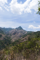 Fototapeta na wymiar Mountain valley with volcano and road. Guatemala.