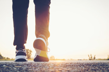 young man running sport feet on trail healthy lifestyle