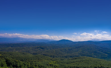 Fototapeta premium Aerial landscape. Hills covered with forest.