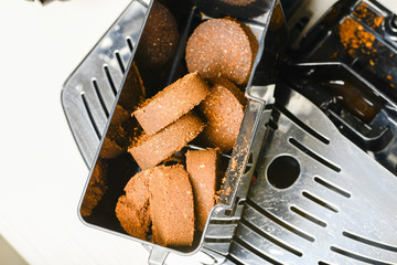 Compressed coffee grounds from the coffee machine