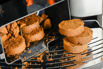 Compressed coffee grounds from the coffee machine