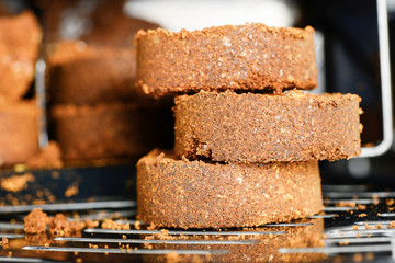 Compressed coffee grounds from the coffee machine