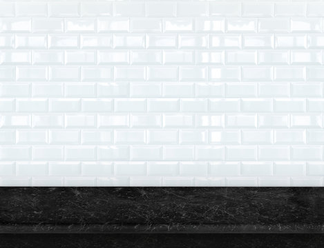 Empty black marble table top with glossy ceramic white tile wall
