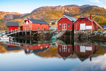 Traditional Norwegian red wooden barns © evannovostro