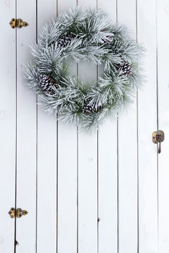 Snowy Winter Christmas Wreath On A Barn Door