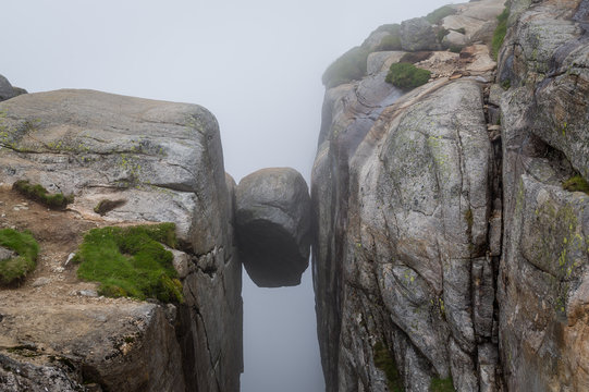 Kjerag Stone, Hanging On The Cliff Between Two High Rocks.