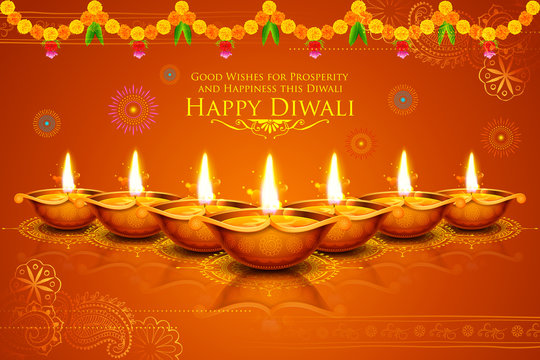 Burning diya on Happy Diwali Holiday background for light festival of India