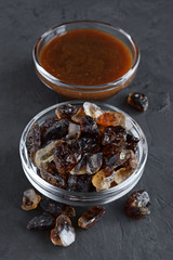Caramelized sugar and liquid caramel in glass bowls