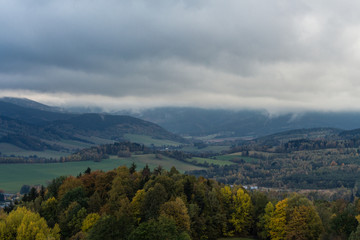 Fototapeta premium Summer landscape in mountains and the dark blue sky with clouds