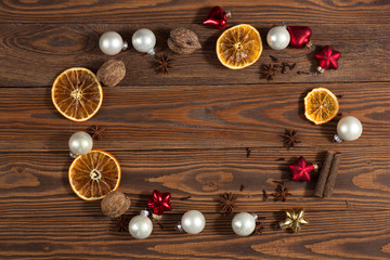 Christmas toys, oranges, nuts on a wooden background concept Chr