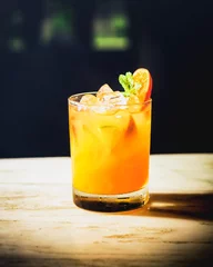 Photo sur Plexiglas Cocktail Orange caipirinha on the counter bar.
