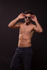 Fototapeta premium confident young man posing abs