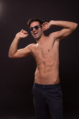 Fototapeta na wymiar confident young man posing abs