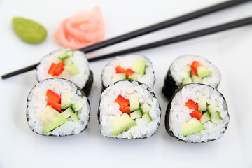 Futomaki, pepper and avocado. Traditional japanese sushi rolls