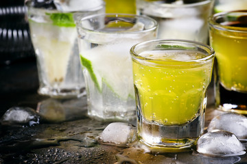 Orange and lime alcoholic cocktails with vodka and soda, metalli