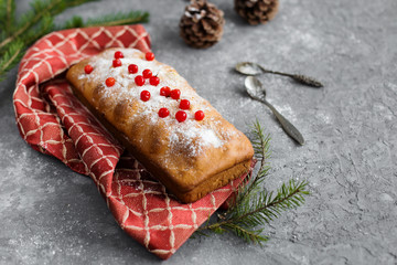 Christmas cake with berries on a gray background