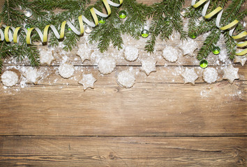 Christmas background of fir branches and ginger cookies