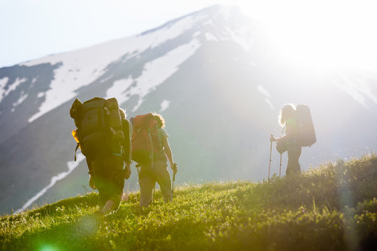 Young People Are Hiking In Highlands Of Altai Mountains, Russia