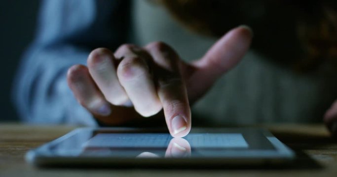 hand typing and touch a screen LCD and interacts with applications and finance and mathematical charts. concept of Technology and simple technology concept applied to the average user friendly.