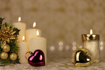 Christmas greeting card with tree, candles, lights and shinny hearts decorations.