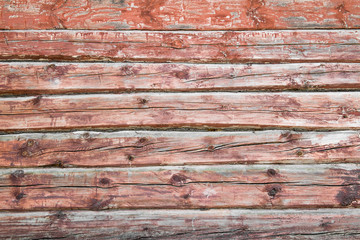 Old weathered planks painted in red.