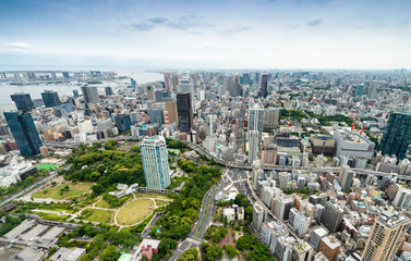 Fototapeta premium TOKYO - MAY 2016: Aerial view of city skyline. Tokyo attracts 15