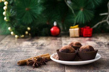 Christmas chocolate truffles on wooden table

