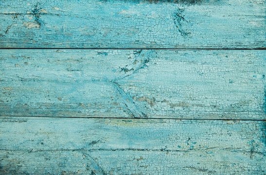 Old weathered plank painted in blue.
