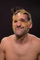 head face wrapped duct tape young man