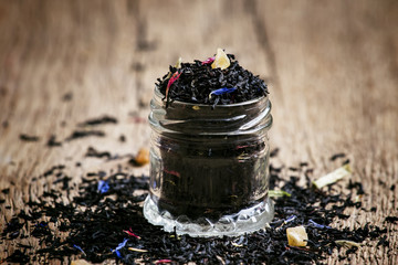 Fototapeta na wymiar Dry Ceylon black tea with cornflower blue flowers and dried frui