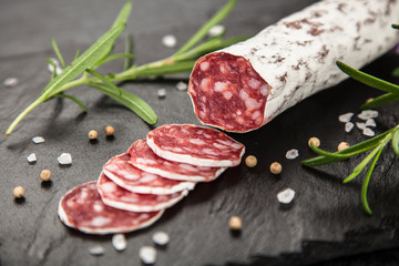 Salami on dark background