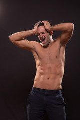 Fototapeta na wymiar shocked young man shirtless abs