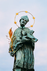 The statue of St. John of Nepomuk on Charles bridge in Prague