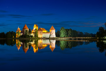 Fototapeta premium Trakai Castle at night - Island castle in Trakai isd one of the most popular touristic destinations in Lithuania, houses a museum and a cultural center.