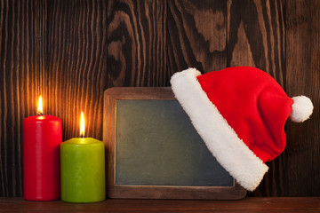 Obraz na płótnie Canvas Christmas candles and chalkboard
