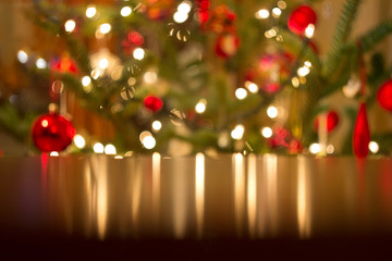 christmas background, defocused lights reflect in the table
