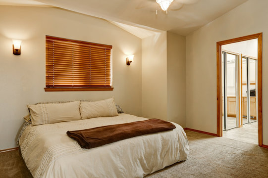 Light tones bedroom interior with carpet floor