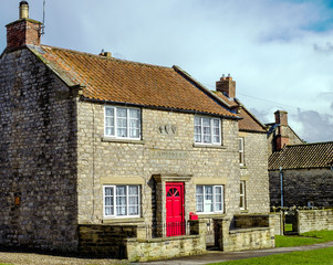 Iconic stone cottage in the village of Appleton le Moors, which is located in the North York Moors National Park, North Yorkshire, England