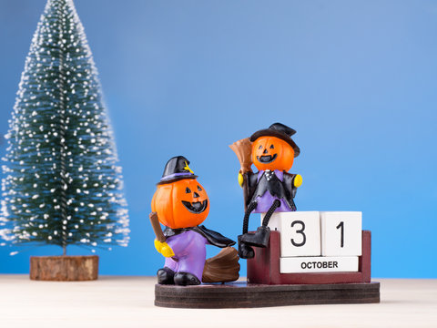 pumpkin toy figures playing on calendar date of 31 Octorber