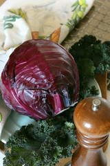 A head of purple cabbage on the board..