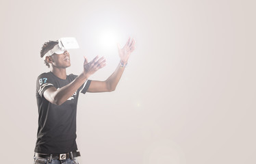 Young man with virtual reality headset or 3d glasses