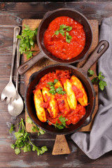 quenelle with tomato sauce
