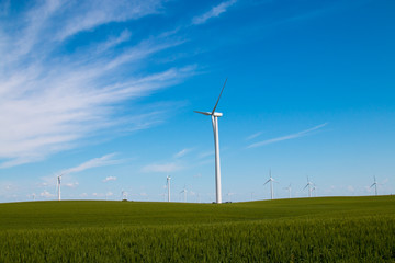Fototapeta na wymiar Blue Sky Wind Turbine