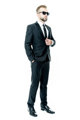 Handsome bearded man wearing suit, portrait shot in studio