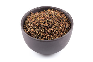 Decorticated cardamom seeds in a bowl